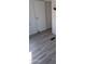 Spacious bedroom with gray vinyl flooring and a large closet at 303 S Recker Rd # 126, Mesa, AZ 85206