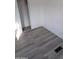 Bedroom with gray vinyl floors and sliding closet doors at 303 S Recker Rd # 126, Mesa, AZ 85206