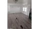 Large living room featuring light grey wood-look flooring at 303 S Recker Rd # 126, Mesa, AZ 85206