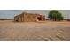 Single-story home featuring two garage doors and a small front porch with a red tile roof at 30508 N 239Th Dr, Wittmann, AZ 85361