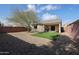 Landscaped backyard with artificial turf and gravel at 3135 W Pecan Rd, Phoenix, AZ 85041