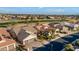 Aerial view of a single-Gathering home with a two-car garage, situated in a golf course community at 3171 N 159Th Ave, Goodyear, AZ 85395