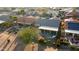 Aerial view of a backyard oasis with a patio, covered seating area, and fire pit at 3171 N 159Th Ave, Goodyear, AZ 85395