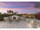 Relaxing backyard oasis with a fire pit and seating area, perfect for entertaining at 3171 N 159Th Ave, Goodyear, AZ 85395