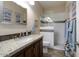 Bathroom with granite vanity, shower, and updated fixtures at 3171 N 159Th Ave, Goodyear, AZ 85395