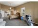Bright bedroom with ensuite bathroom access and exercise equipment at 3171 N 159Th Ave, Goodyear, AZ 85395
