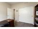 Bright bedroom with double doors leading to the bathroom and a built-in closet at 3171 N 159Th Ave, Goodyear, AZ 85395