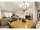 Elegant dining room featuring a round table and a chandelier at 3171 N 159Th Ave, Goodyear, AZ 85395