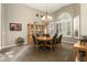 Formal dining room with a large table and chandelier at 3171 N 159Th Ave, Goodyear, AZ 85395