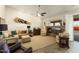 Spacious living room features stone fireplace and access to backyard patio at 3171 N 159Th Ave, Goodyear, AZ 85395