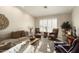 Cozy living room featuring comfortable seating and large windows at 3171 N 159Th Ave, Goodyear, AZ 85395