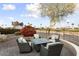 Patio with fire pit and comfortable seating area at 3171 N 159Th Ave, Goodyear, AZ 85395