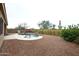 Relaxing backyard oasis featuring a kidney-shaped pool and a spacious gravel area at 34910 N 27Th Ave, Phoenix, AZ 85086