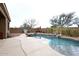 Stunning pool with a waterfall feature and a large patio area at 34910 N 27Th Ave, Phoenix, AZ 85086