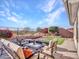 Landscaped backyard oasis with firepit, patio furniture, and scenic views at 41933 N Crooked Stick Rd, Anthem, AZ 85086