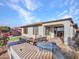 Covered patio with built-in grill and artificial turf at 41933 N Crooked Stick Rd, Anthem, AZ 85086