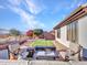 Outdoor entertaining space with fire pit and seating, perfect for relaxing evenings at 41933 N Crooked Stick Rd, Anthem, AZ 85086