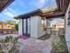 Stone patio with double doors leading to a casita and a wrought iron gate at 41933 N Crooked Stick Rd, Anthem, AZ 85086