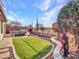 Artificial turf lawn, flagstone patio, and a firepit at 41933 N Crooked Stick Rd, Anthem, AZ 85086