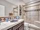 Bathroom with a large walk-in shower and dark brown vanity at 41933 N Crooked Stick Rd, Anthem, AZ 85086