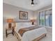 Main bedroom with king-size bed, nightstands, and window shutters at 41933 N Crooked Stick Rd, Anthem, AZ 85086
