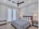 Bright bedroom with a comfortable bed and access to a patio at 41933 N Crooked Stick Rd, Anthem, AZ 85086