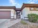 Front entry with iron gate and stone pathway at 41933 N Crooked Stick Rd, Anthem, AZ 85086