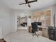 Home office with view into living area and built-in desk at 41933 N Crooked Stick Rd, Anthem, AZ 85086