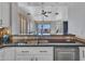 Kitchen with a breakfast bar and view to backyard patio at 41933 N Crooked Stick Rd, Anthem, AZ 85086