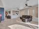 Open living room with a view of the kitchen and access to backyard at 41933 N Crooked Stick Rd, Anthem, AZ 85086