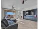 Spacious living room with leather sofa and large TV at 41933 N Crooked Stick Rd, Anthem, AZ 85086