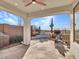 Covered patio with built-in grill, seating area, and stunning views at 41933 N Crooked Stick Rd, Anthem, AZ 85086