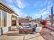 Stone patio with fire pit and comfortable seating, ideal for outdoor gatherings at 41933 N Crooked Stick Rd, Anthem, AZ 85086