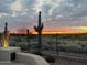 Scenic sunset over golf course from backyard at 41933 N Crooked Stick Rd, Anthem, AZ 85086