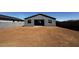 Wide backyard with a dark gray fence, and a freshly filled in area ready for grass or landscaping at 4353 E Bradford Ave, San Tan Valley, AZ 85140