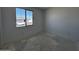 A bright bedroom with a large window allowing ample natural light in the space at 4353 E Bradford Ave, San Tan Valley, AZ 85140