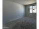 A spacious bedroom with a large window, providing plenty of natural light and ventilation at 4353 E Bradford Ave, San Tan Valley, AZ 85140