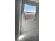 A bedroom with a bright window that provides natural light, enhancing the room's airy feel at 4353 E Bradford Ave, San Tan Valley, AZ 85140