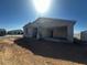 Single-story home showcasing a stucco exterior, front porch, and attached garage, awaiting personalized finishing touches at 4353 E Bradford Ave, San Tan Valley, AZ 85140