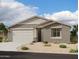 One-story home with neutral exterior and two-car garage at 4353 E Bradford Ave, San Tan Valley, AZ 85140