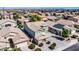 Aerial view showcasing a two-story house, solar panels, and neighborhood context at 4628 W Hasan Dr, Laveen, AZ 85339