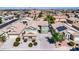 Aerial view of a two-story house with solar panels in a residential neighborhood at 4628 W Hasan Dr, Laveen, AZ 85339