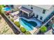 Aerial view of a house with a pool and a backyard at 4628 W Hasan Dr, Laveen, AZ 85339