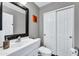 Clean bathroom with white vanity and large mirror at 4628 W Hasan Dr, Laveen, AZ 85339