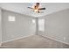 Bedroom with a ceiling fan, neutral carpet, and a small window at 4628 W Hasan Dr, Laveen, AZ 85339