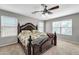 Main bedroom with a large bed and window seating at 4628 W Hasan Dr, Laveen, AZ 85339