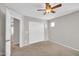 Bedroom with a ceiling fan, neutral carpet, and sliding closet doors at 4628 W Hasan Dr, Laveen, AZ 85339