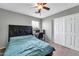 Bedroom with a bed, workspace, and closet at 4628 W Hasan Dr, Laveen, AZ 85339