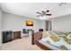 Main bedroom with TV, desk, and large bed at 4628 W Hasan Dr, Laveen, AZ 85339