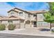 Two-story house with double garage and well-manicured landscaping at 4628 W Hasan Dr, Laveen, AZ 85339